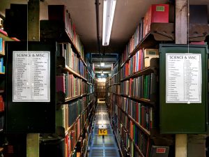 Photo of back stacks and London Library classification scheme